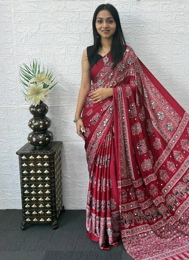 maroon color mirror work border with handcrafted red tassels (latkan) and ajarakh print gajji silk blend saree