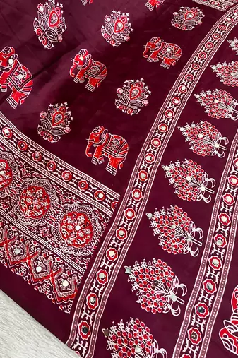 maroon color mirror work border with handcrafted red tassels (latkan) and ajarakh print gajji silk blend saree