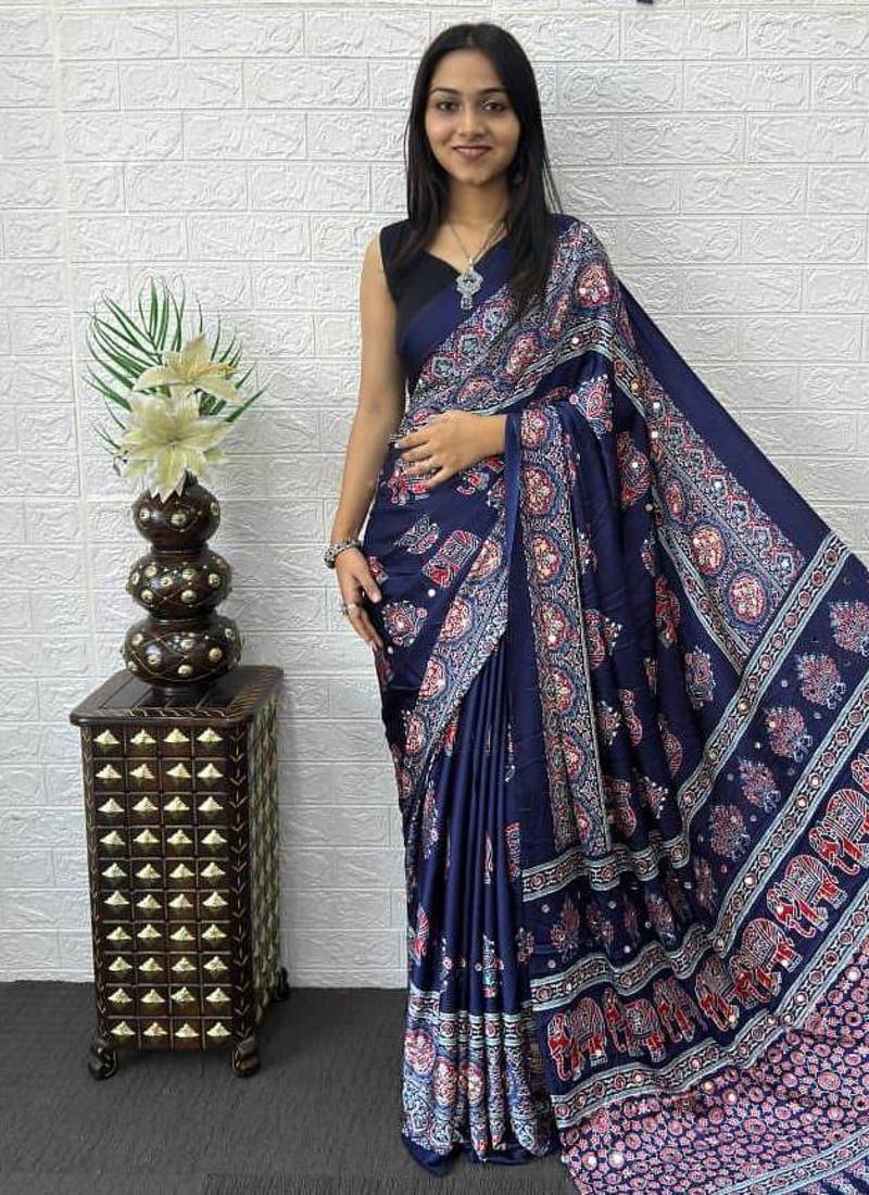 neavy blue color mirror work border with handcrafted red tassels (latkan) and ajarakh print gajji silk blend saree