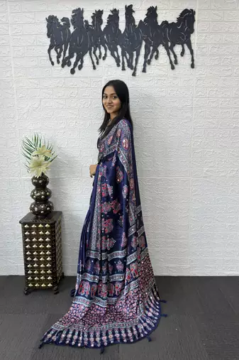 neavy blue color mirror work border with handcrafted red tassels (latkan) and ajarakh print gajji silk blend saree