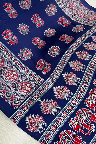 neavy blue color mirror work border with handcrafted red tassels (latkan) and ajarakh print gajji silk blend saree