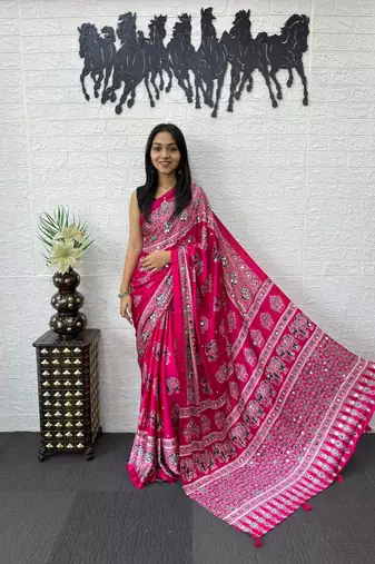 rani pink color mirror work border with handcrafted red tassels (latkan) and ajarakh print gajji silk blend saree