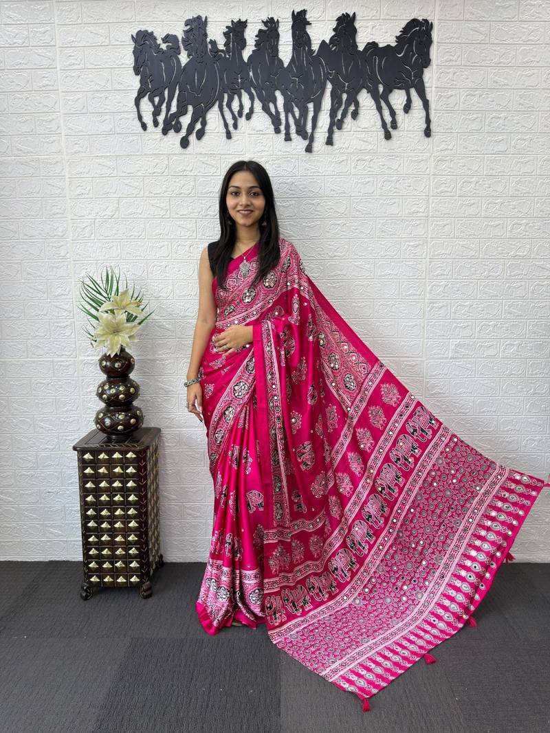 rani pink color mirror work border with handcrafted red tassels (latkan) and ajarakh print gajji silk blend saree