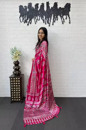 rani pink color mirror work border with handcrafted red tassels (latkan) and ajarakh print gajji silk blend saree