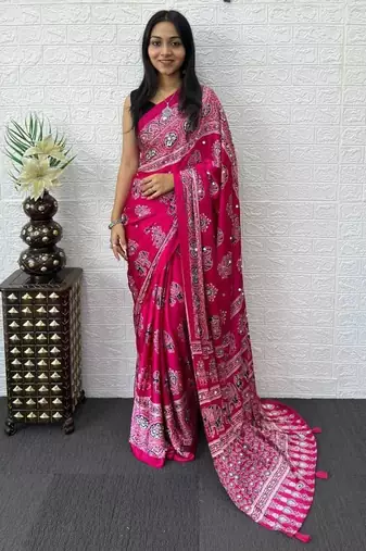 rani pink color mirror work border with handcrafted red tassels (latkan) and ajarakh print gajji silk blend saree