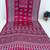 rani pink color mirror work border with handcrafted red tassels (latkan) and ajarakh print gajji silk blend saree