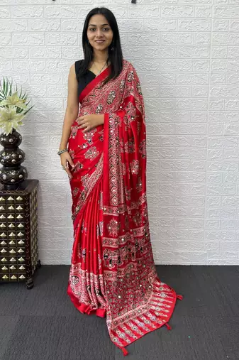 red color mirror work border with handcrafted red tassels (latkan) and ajarakh print gajji silk blend saree