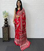 red color mirror work border with handcrafted red tassels (latkan) and ajarakh print gajji silk blend saree