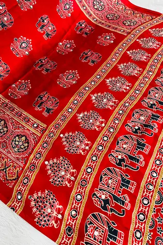 red color mirror work border with handcrafted red tassels (latkan) and ajarakh print gajji silk blend saree