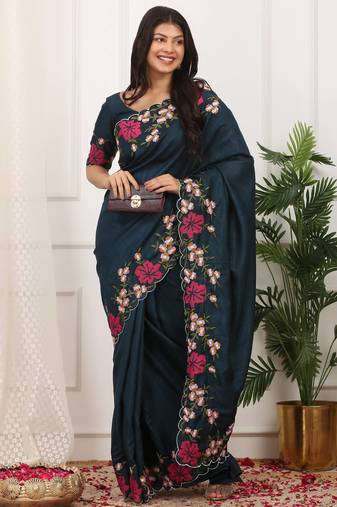 teal color multi color thread work on border with cutwork silk blend saree