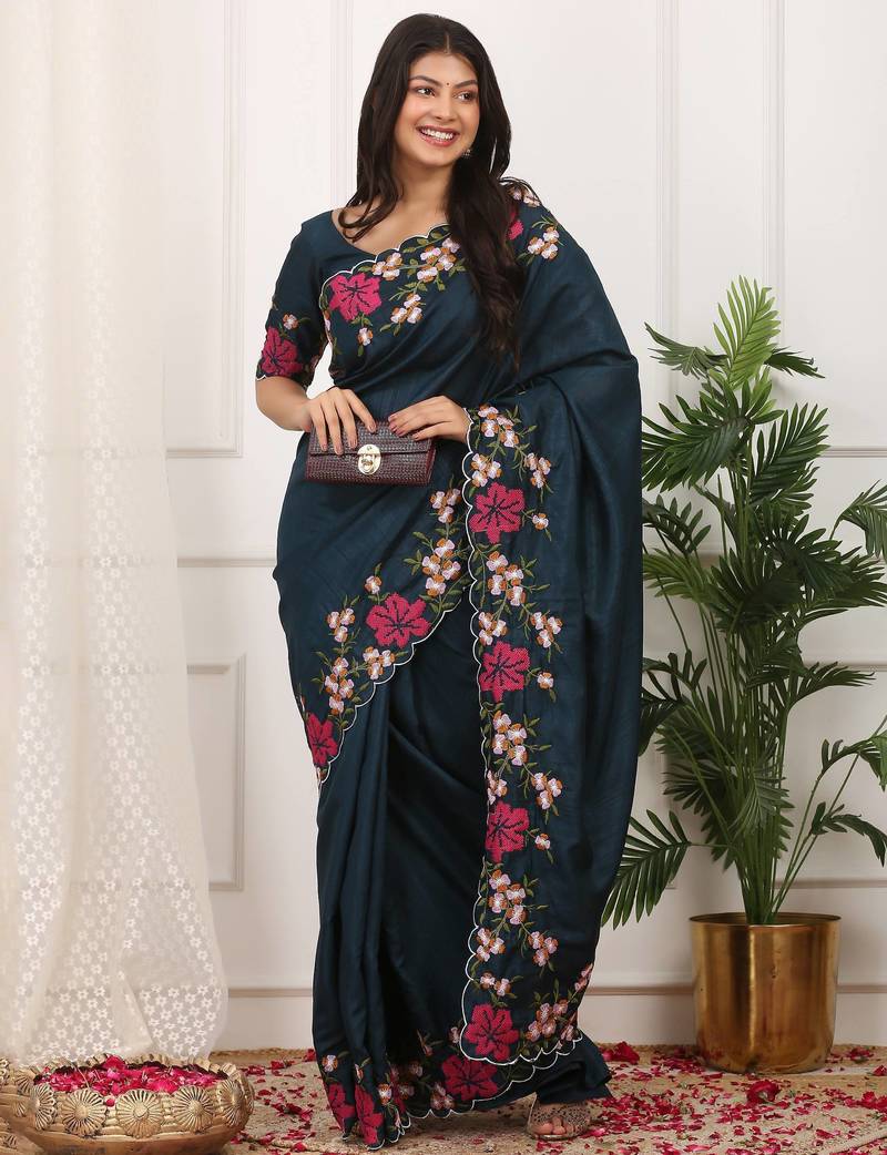 teal color multi color thread work on border with cutwork silk blend saree