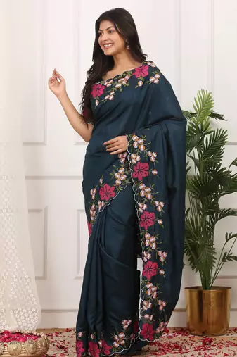 teal color multi color thread work on border with cutwork silk blend saree