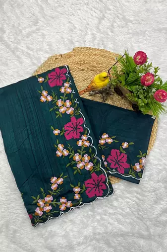 teal color multi color thread work on border with cutwork silk blend saree