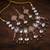 pink mehndi-plated agate stone necklace set with earrings & maang tikka