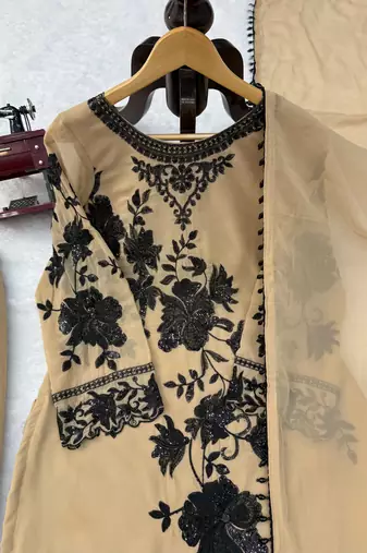 Beige faux georgette embroidered palazzo suit with dupatta