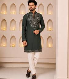 Dark bottle green silk blend heavy embroidered kurta with off white straight pant for wedding & festive wear