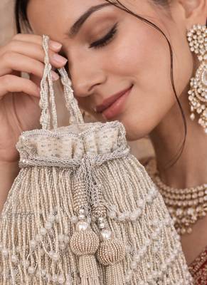 Silver ivory silk fringe potli bag 1