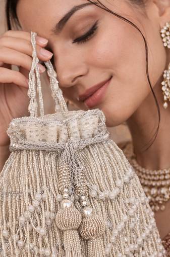 Silver ivory silk fringe potli bag