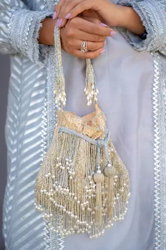 Silver ivory silk fringe potli bag