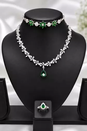 Green american diamond necklace set with adjustable bracelet and ring for women and girls.