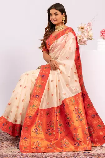 Women's white soft tissue silk zari woven saree with blouse
