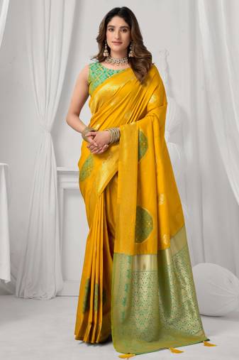 Women's yellow soft silk zari woven saree with blouse