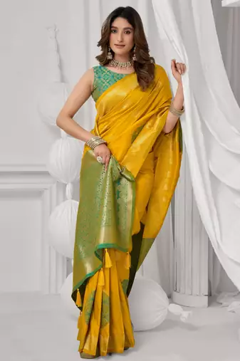 Women's yellow soft silk zari woven saree with blouse