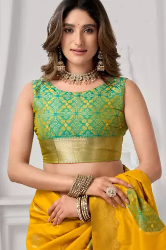 Women's yellow soft silk zari woven saree with blouse