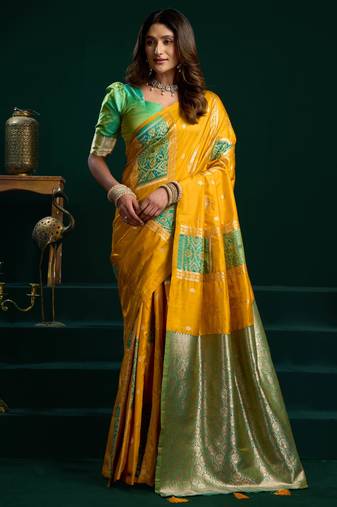 Women's yellow soft silk zari woven saree with blouse