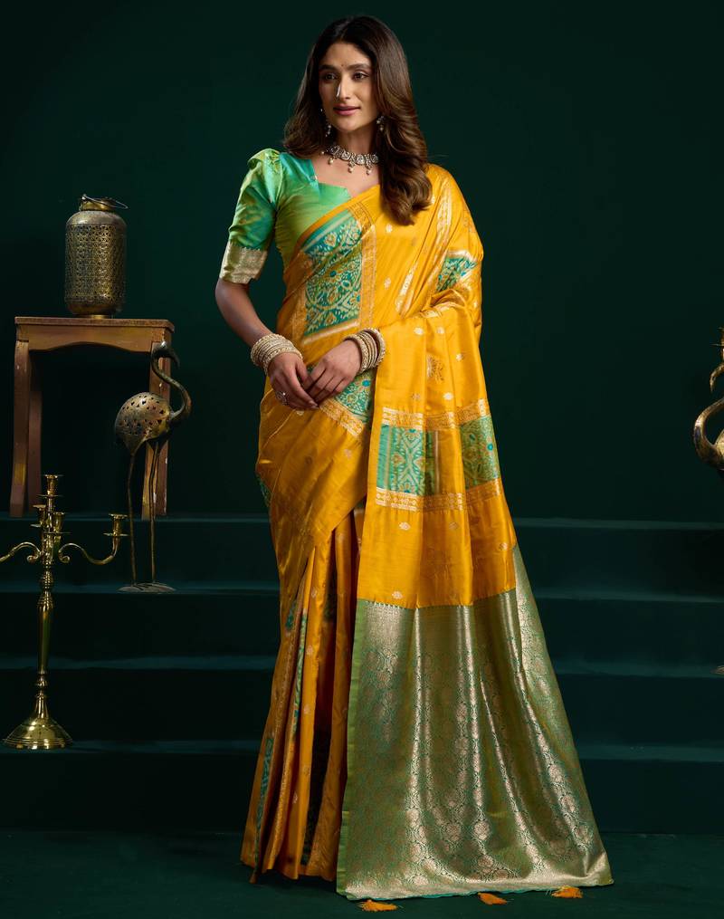 Women's yellow soft silk zari woven saree with blouse