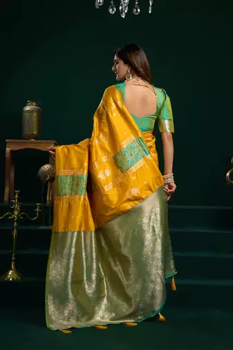 Women's yellow soft silk zari woven saree with blouse