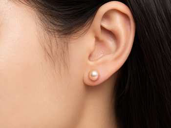 Pink freshwater pearl stud earrings with gold-tone backs 1