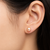 Pink freshwater pearl stud earrings with gold-tone backs