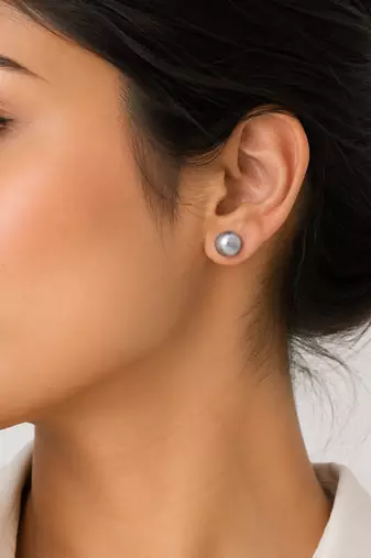 Grey pearl stud earrings with gold-tone backs, round