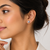 Grey pearl stud earrings with gold-tone backs, round