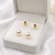 White pearl stud earrings with gold-tone push back clasps