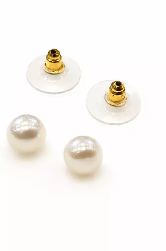 White pearl stud earrings with gold-tone push back clasps