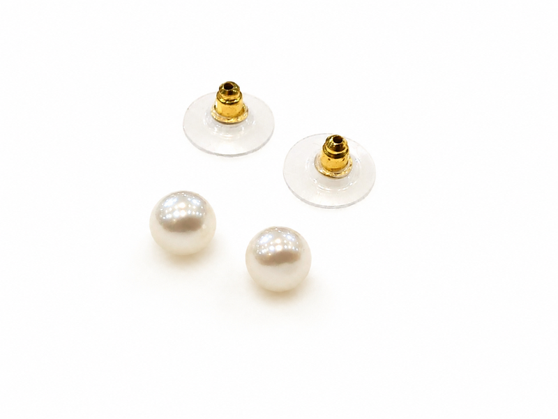 White pearl stud earrings with gold-tone push back clasps