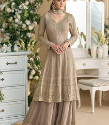 Faux georgette palazzo suit with embroidered work in beige