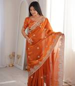 Orange color silk blend embroidered work saree with un-stitched blouse
