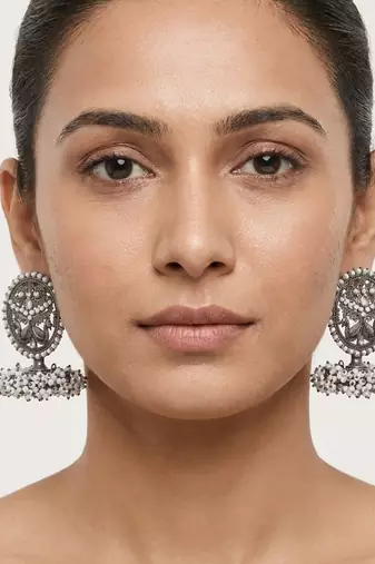Oxidized silver peacock motif statement earrings with white pearl cluster drops