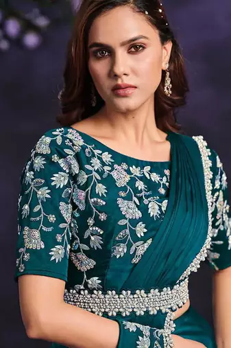 Teal green pre-draped crepe satin silk saree with embroidered blouse and waist belt