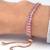 Rose gold plated pink baguette stone studded adjustable charm bracelet jewellery for women