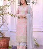 Pink faux georgette embroidered palazzo suit with rivet moti dupatta