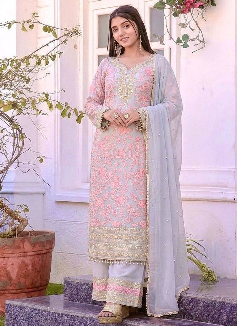 Pink faux georgette embroidered palazzo suit with rivet moti dupatta