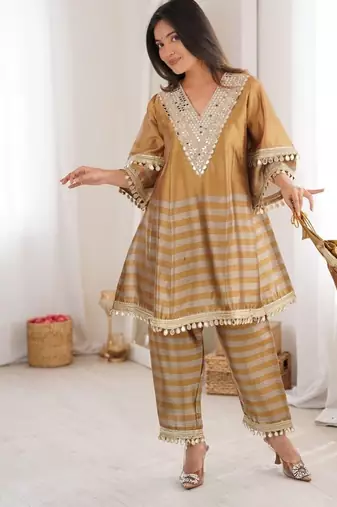 gold two tone line tissue silk coding embroidered mirror work lace kurta straight pant set
