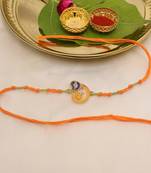 orange ganesha handcrafted beaded thread rakhi with roli chawal capsules