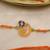 orange ganesha handcrafted beaded thread rakhi with roli chawal capsules