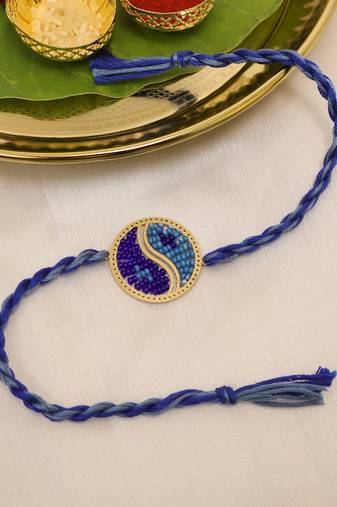 blue yin yang dual tone braided thread rakhi with roli chawal capsules