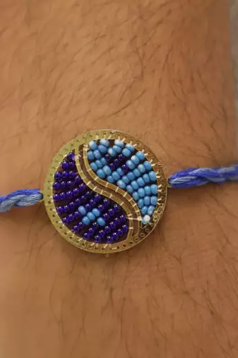 blue yin yang dual tone braided thread rakhi with roli chawal capsules